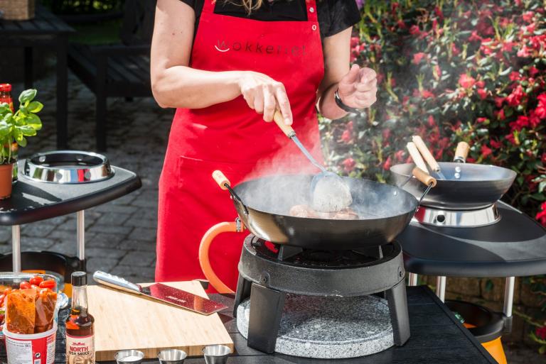 Cooking outside in a wok