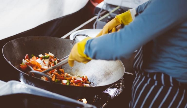 Frying vegetables in a wok